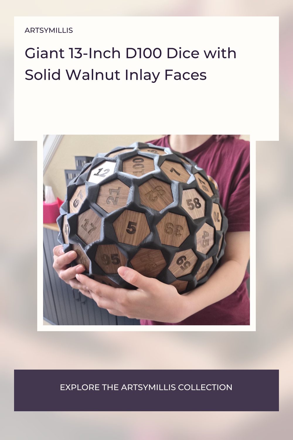 A person holding a large, hexagonal, black and wooden dice with numbers engraved on each face, displayed against a blurred, w